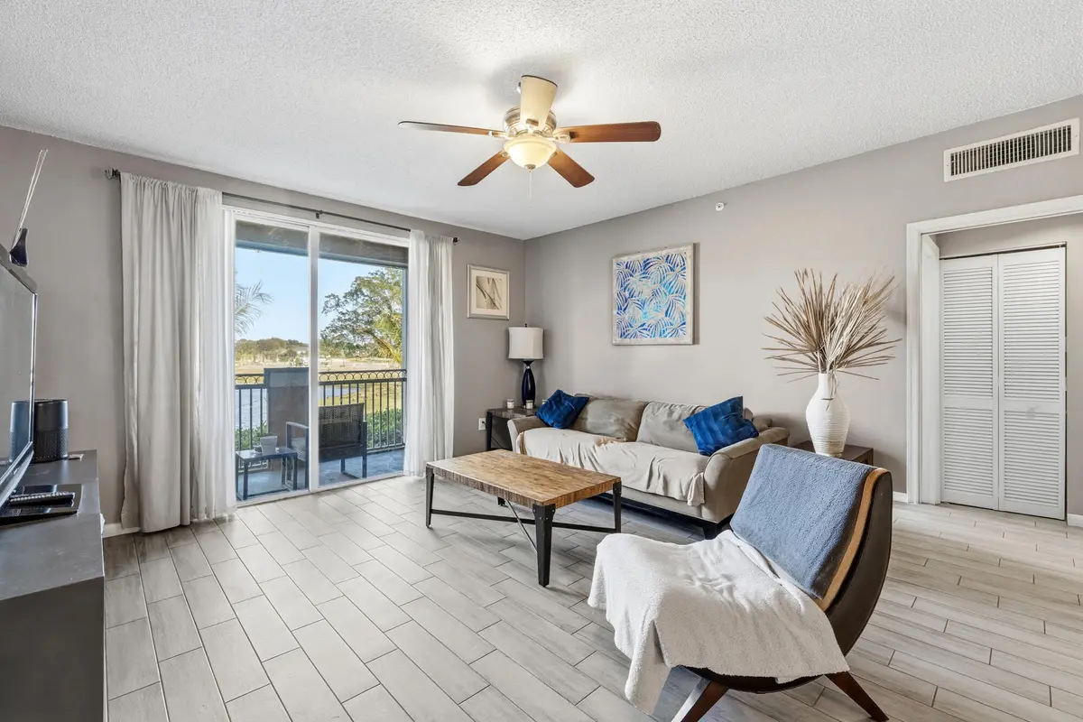 Living room at 11750 Saint Andrews Place 203, Wellington