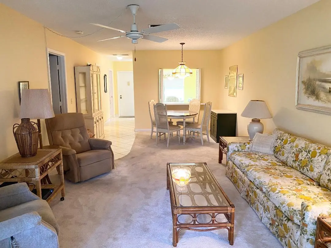 Living room to dining area at 2331 Croton Lane B, Delray Beach