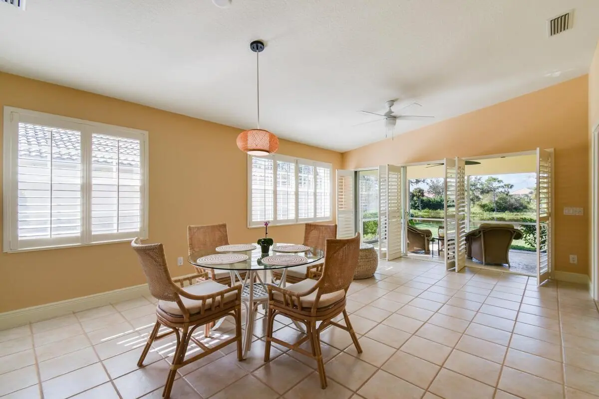 Dining area and Lanai with incredible vi at 8392 SE Paurotis Lane, Hobe Sound