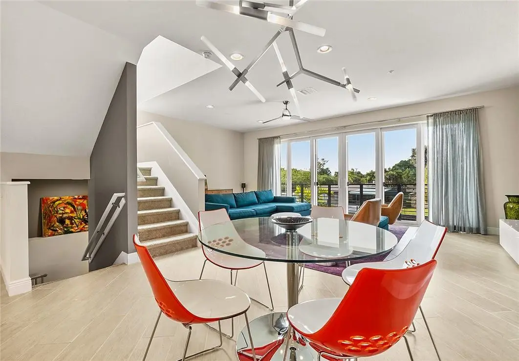 Formal dining with modern lighting. at 2900 NE 12th Terrace 21, Oakland Park