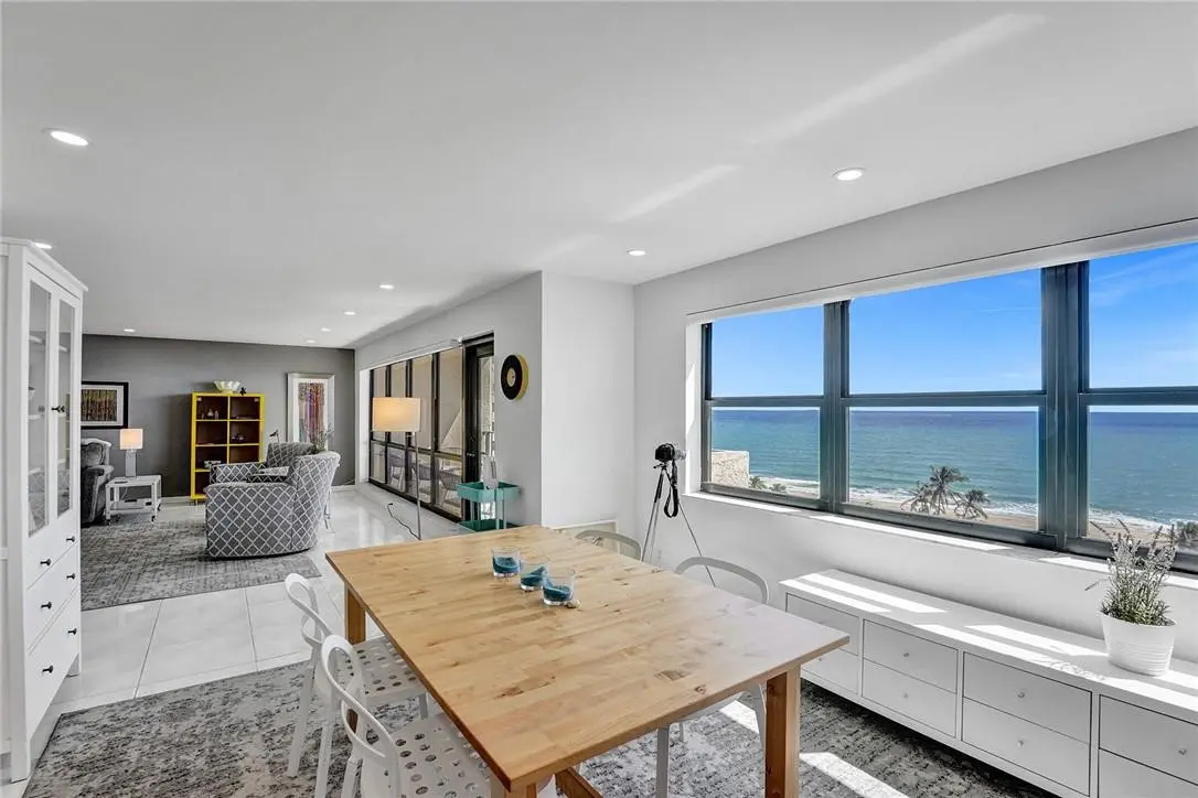 Dining & living room view at 4900 N Ocean Boulevard 1119, Lauderdale-By-The-Sea