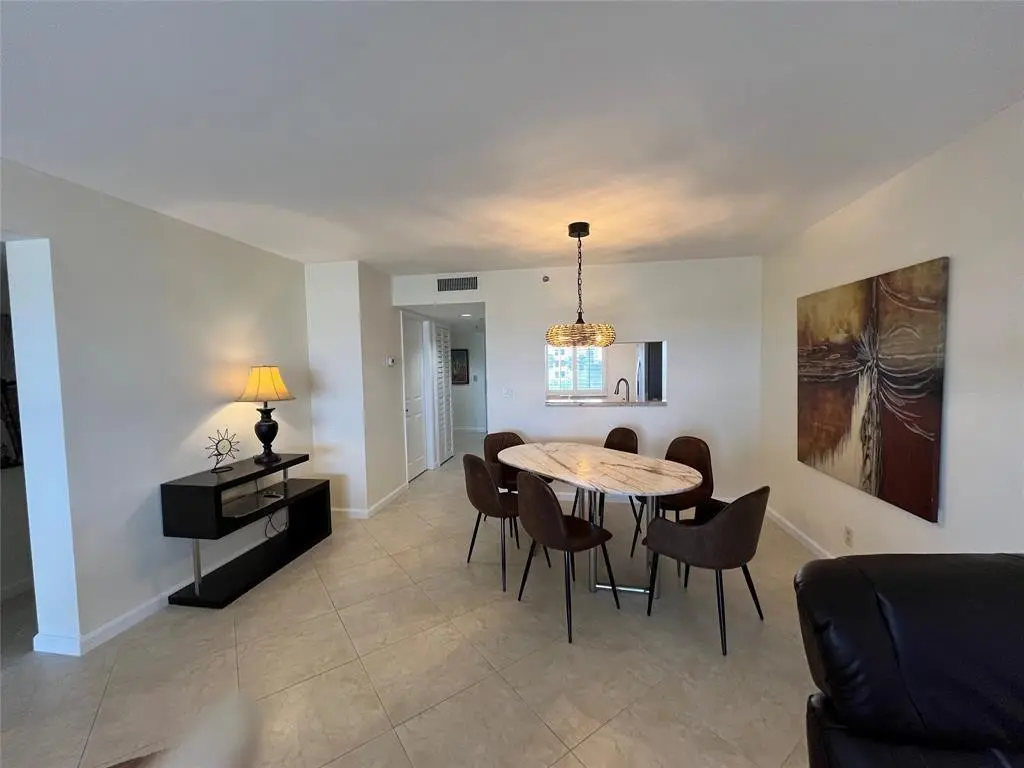 Large formal dining room at 7260 Kinghurst Drive 606, Delray Beach