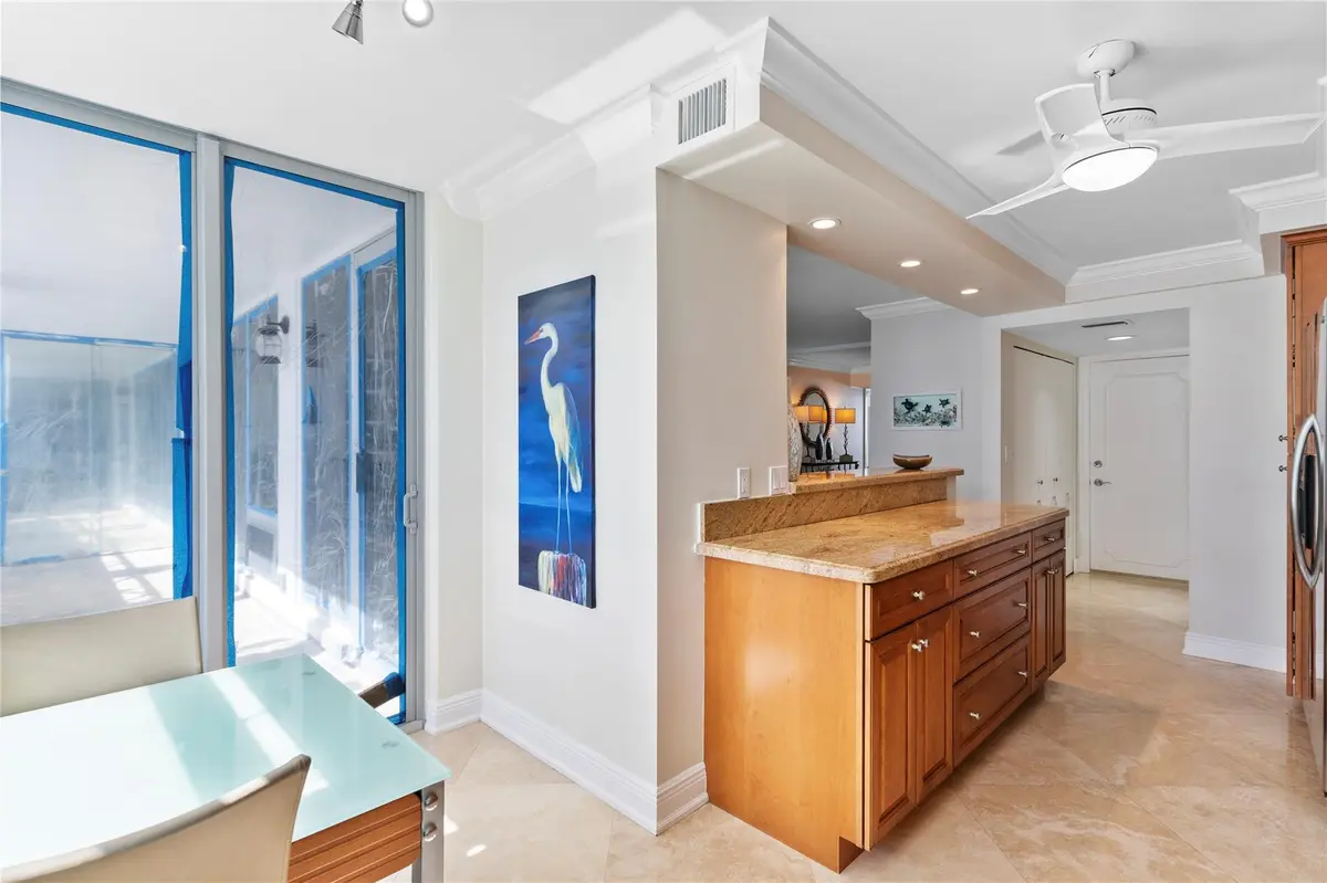Kitchen with access to large balcony, at 4280 Galt Ocean Drive 11L, Fort Lauderdale
