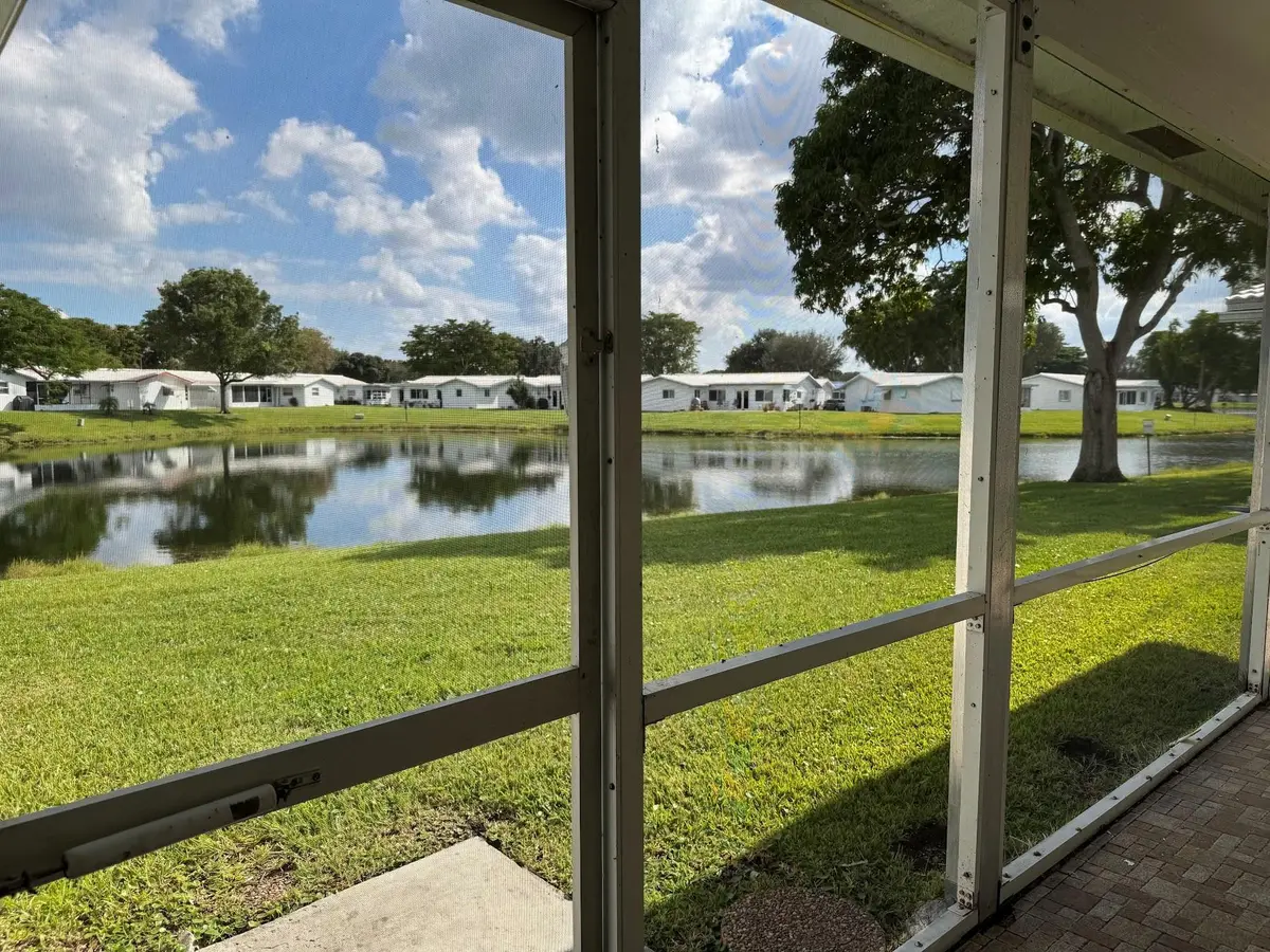 WATER VIEW FROM SCREENED REAR PATIO at 1430 NW 85th Terrace, Plantation
