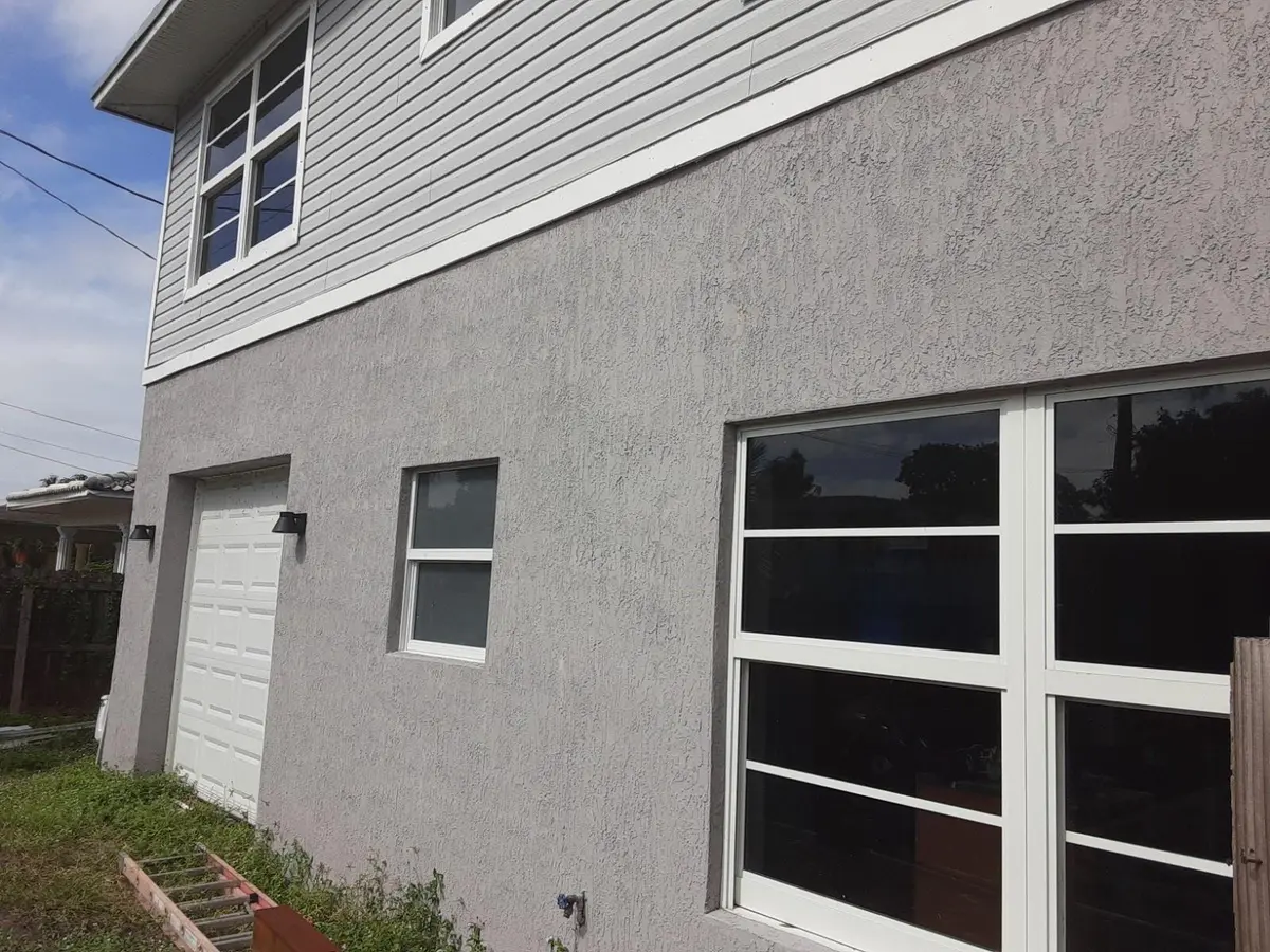 Front of house thru fence at 799 NE 34th Court, Oakland Park