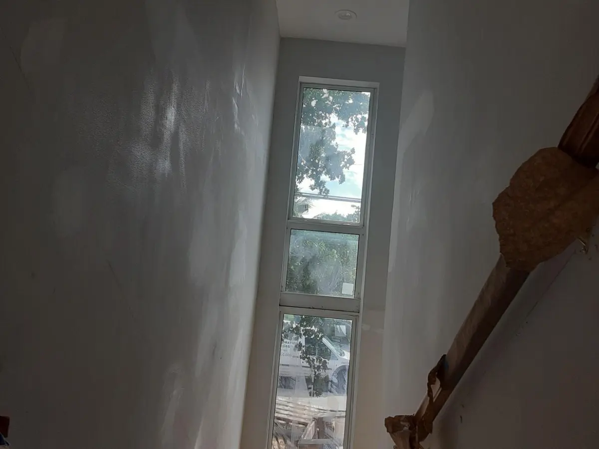 Going down front staircase at 799 NE 34th Court, Oakland Park