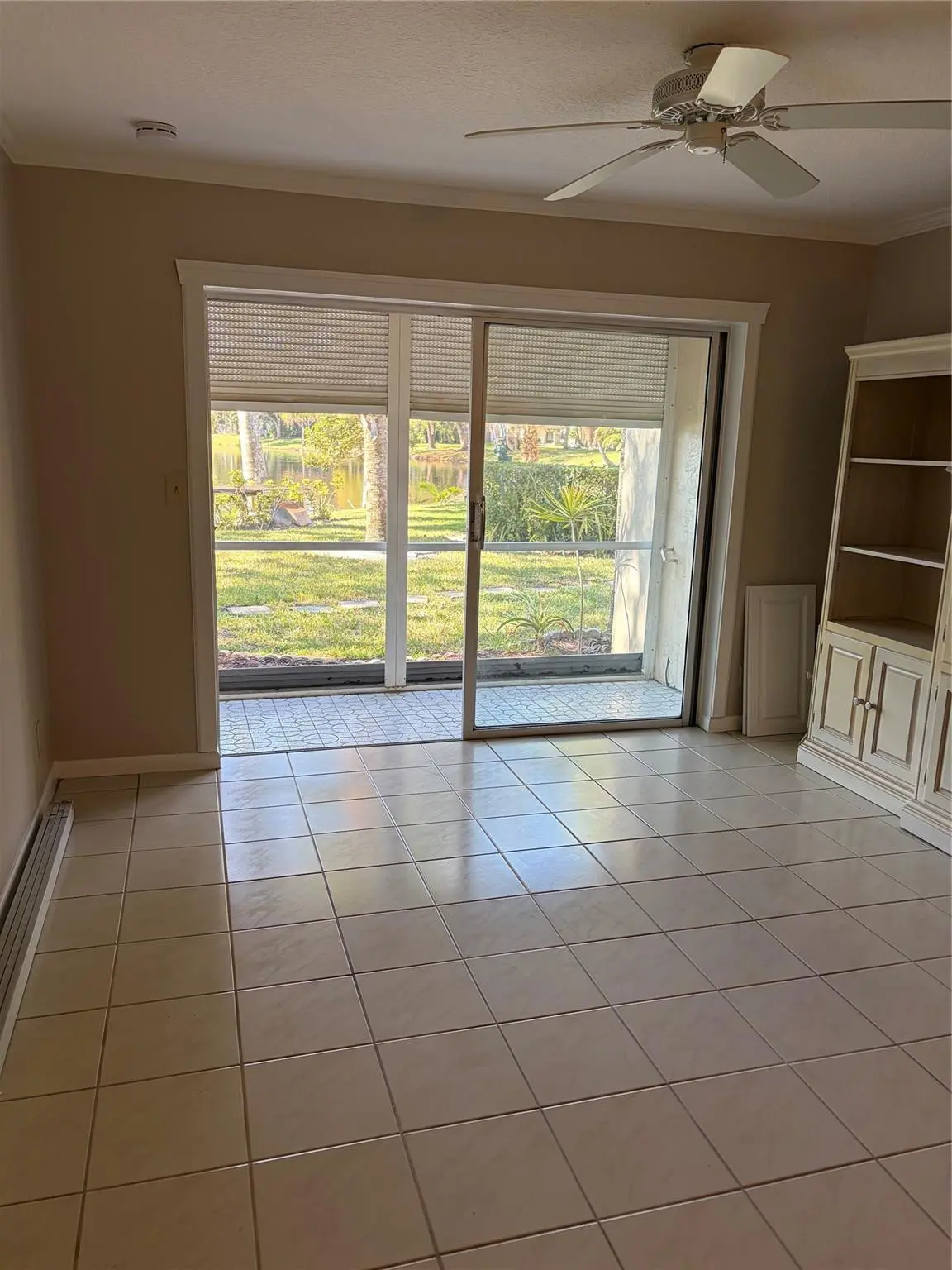 LIVING ROOM TO SCREENED PATIO at 21 Jacaranda Drive 121, Plantation
