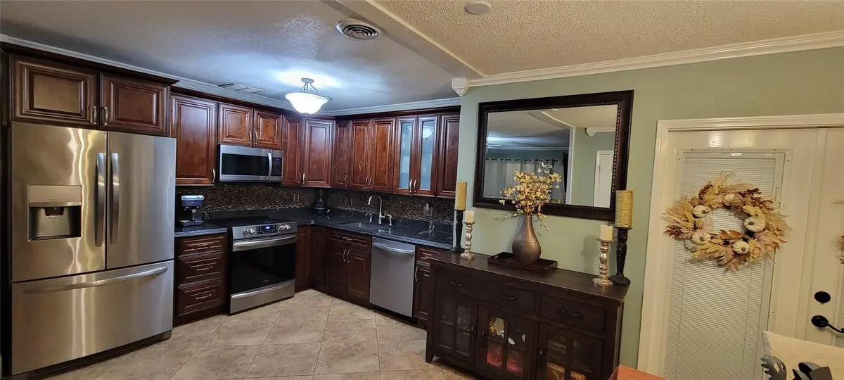 Open concept updated kitchen at 4153 NW 47th Terrace, Lauderdale Lakes