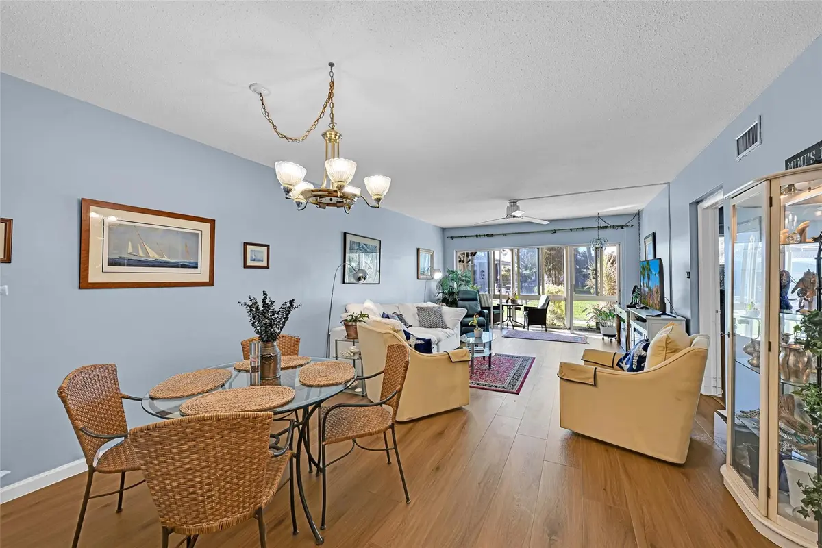Dining and living room at 1100 SW 12th Street 108, Fort Lauderdale