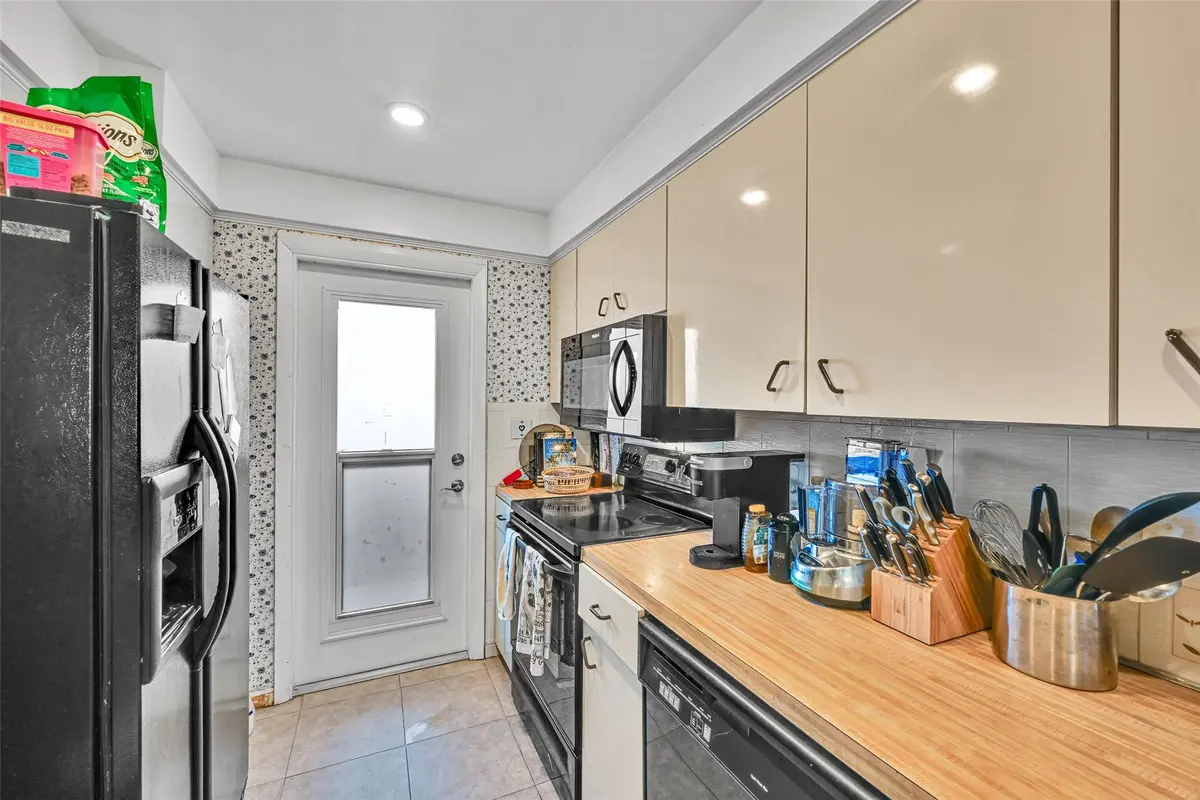 kitchen with impact door and window at 1100 SW 12th Street 108, Fort Lauderdale