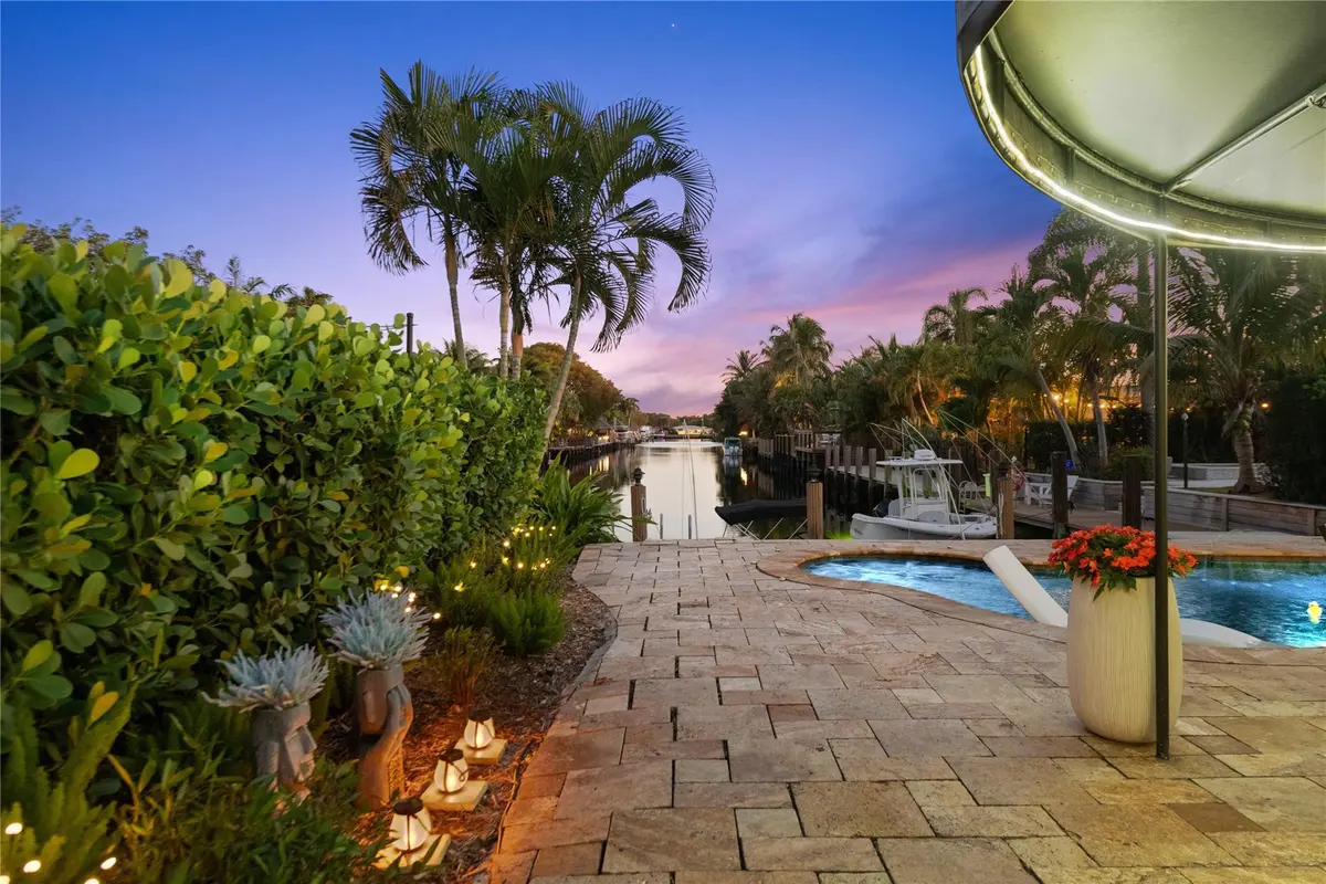 Pool deck area overlooking canal at 1500 NE 24th Street, Wilton Manors