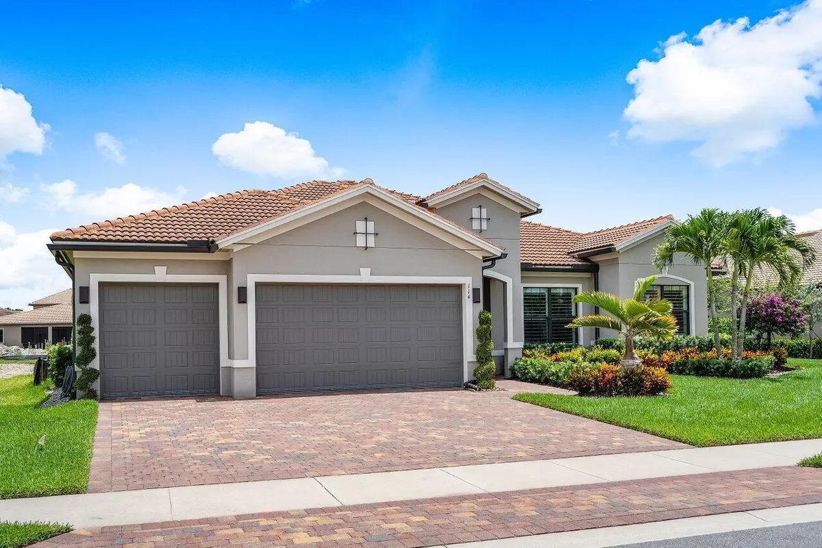 Front elevation at 114 Blanca Isles Lane, Jupiter