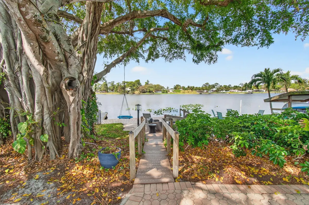 Lush Footpath To The Lake at 6647 Paul Mar Drive, Lantana