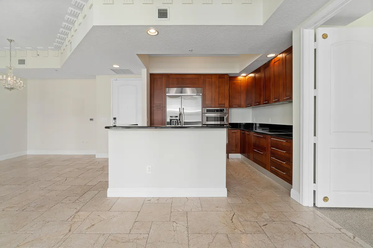 Kitchen w/ Eat-In Bar at 701 S Olive Avenue 2009, West Palm Beach