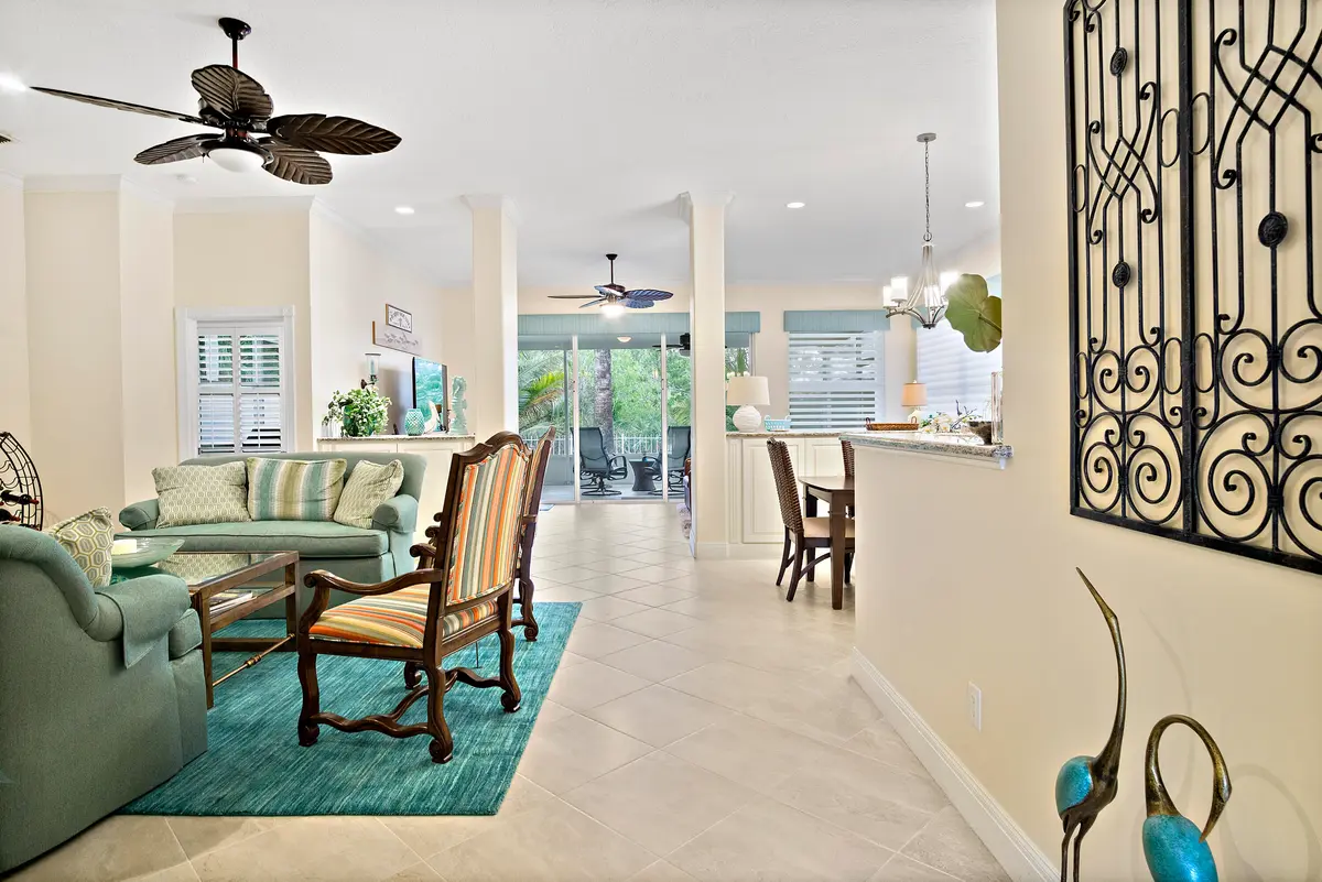 3a. Living room looking out to lanai at 5058 SE Inkwood Way, Hobe Sound