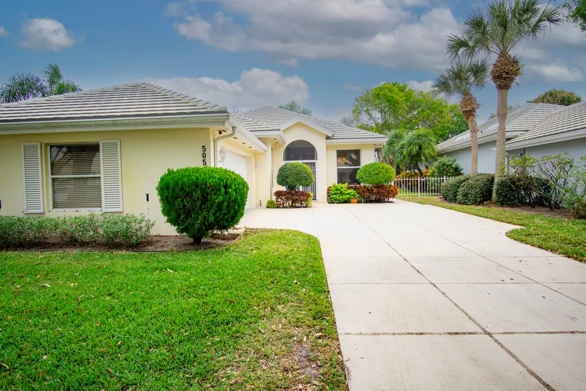 1b. Front view Front yard at 5058 SE Inkwood Way, Hobe Sound