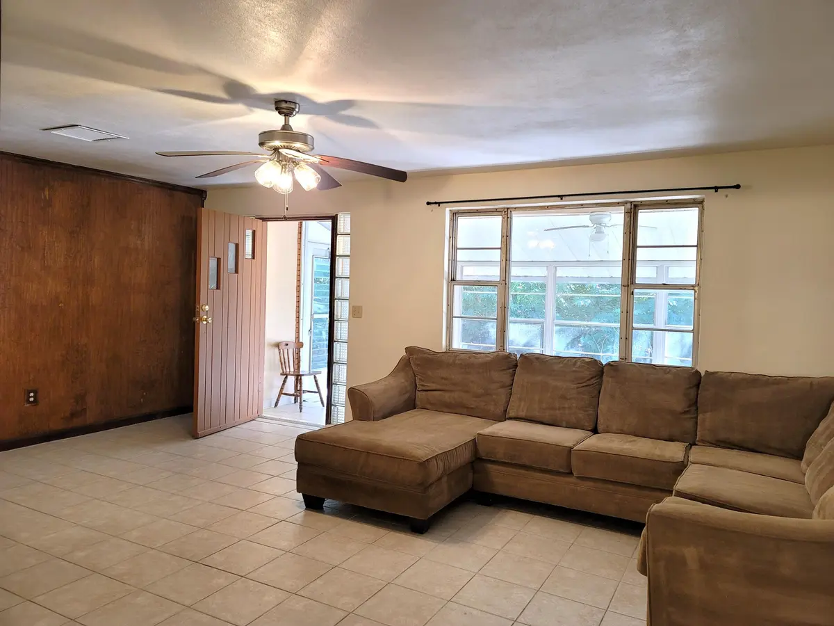 LIVING ROOM FRONT DOOR OPEN at 4362 W Midway Road, Fort Pierce