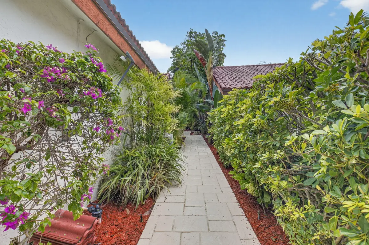 LUSHLY LANDSCAPED ENTRY at 21700 Club Villa Terrace, Boca Raton
