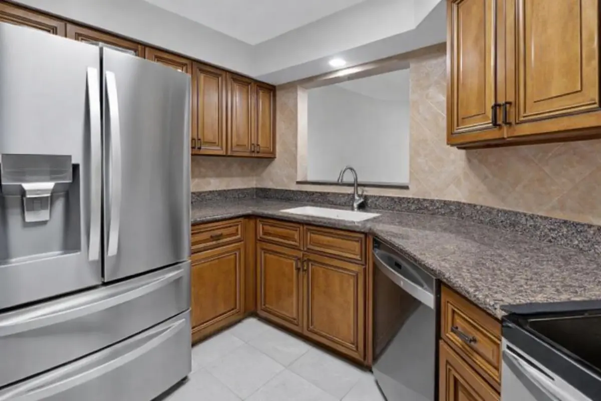 Modern kitchen with stainless appliances at 9064 Boca Gardens Parkway B, Boca Raton