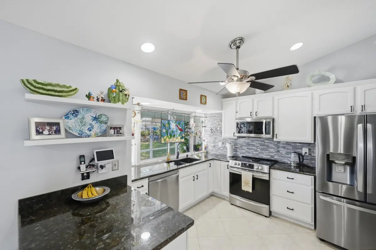 kitchen-granite-torino-psl at 5754 NW Jigsaw Lane, Port St. Lucie