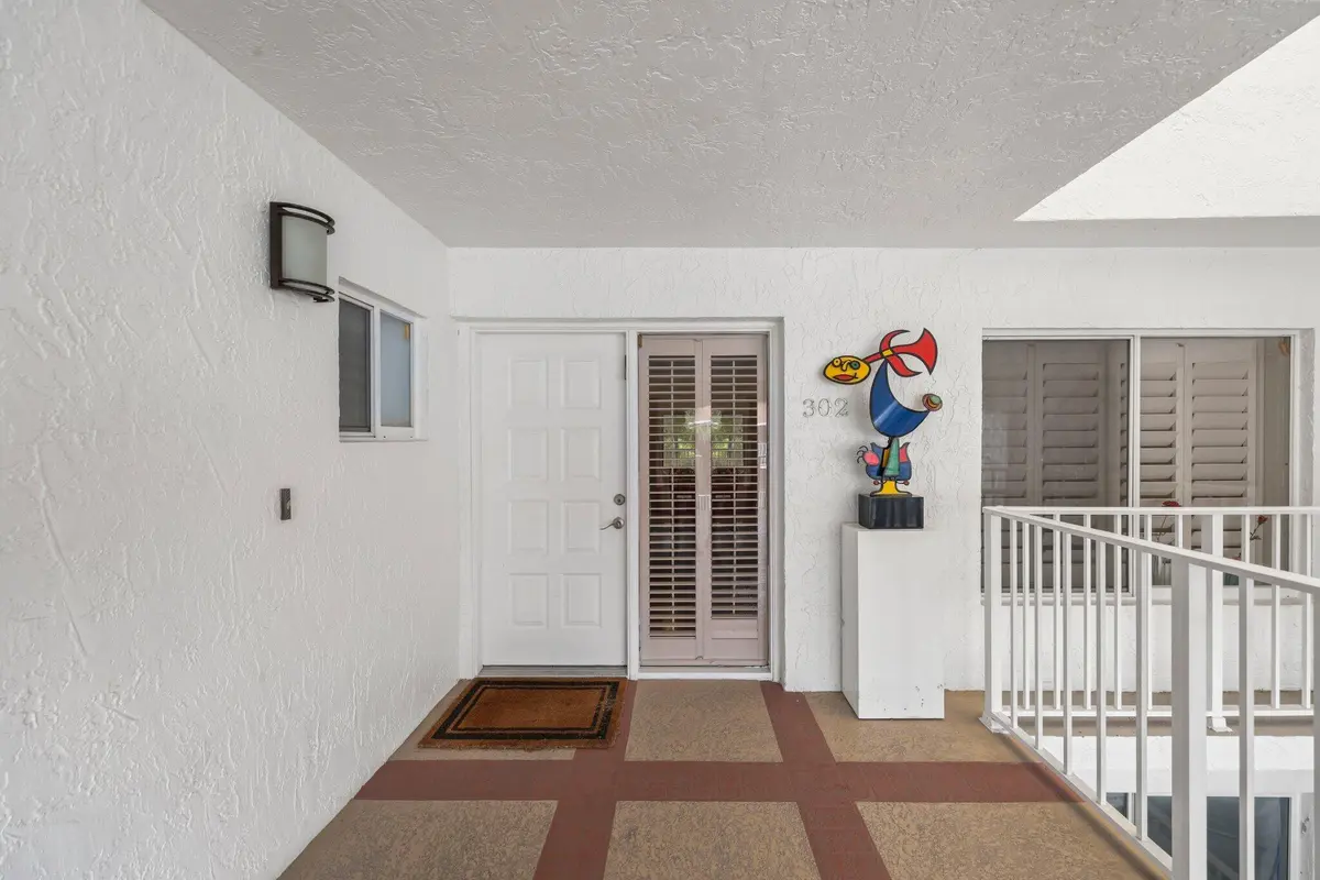 Walkway to front door at 7370 Orangewood Lane 302, Boca Raton