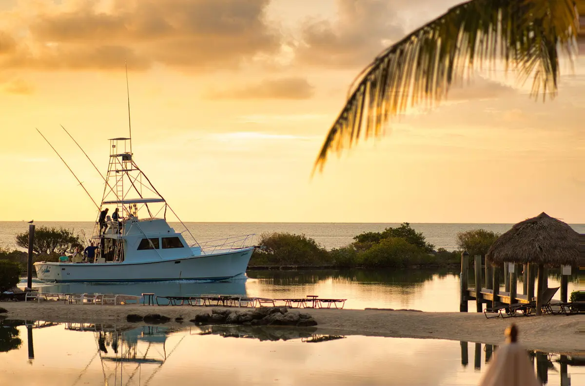 Fishing Boat at Sunset Lit Jims at 9 Harbour Isle Drive 305, Hutchinson Island