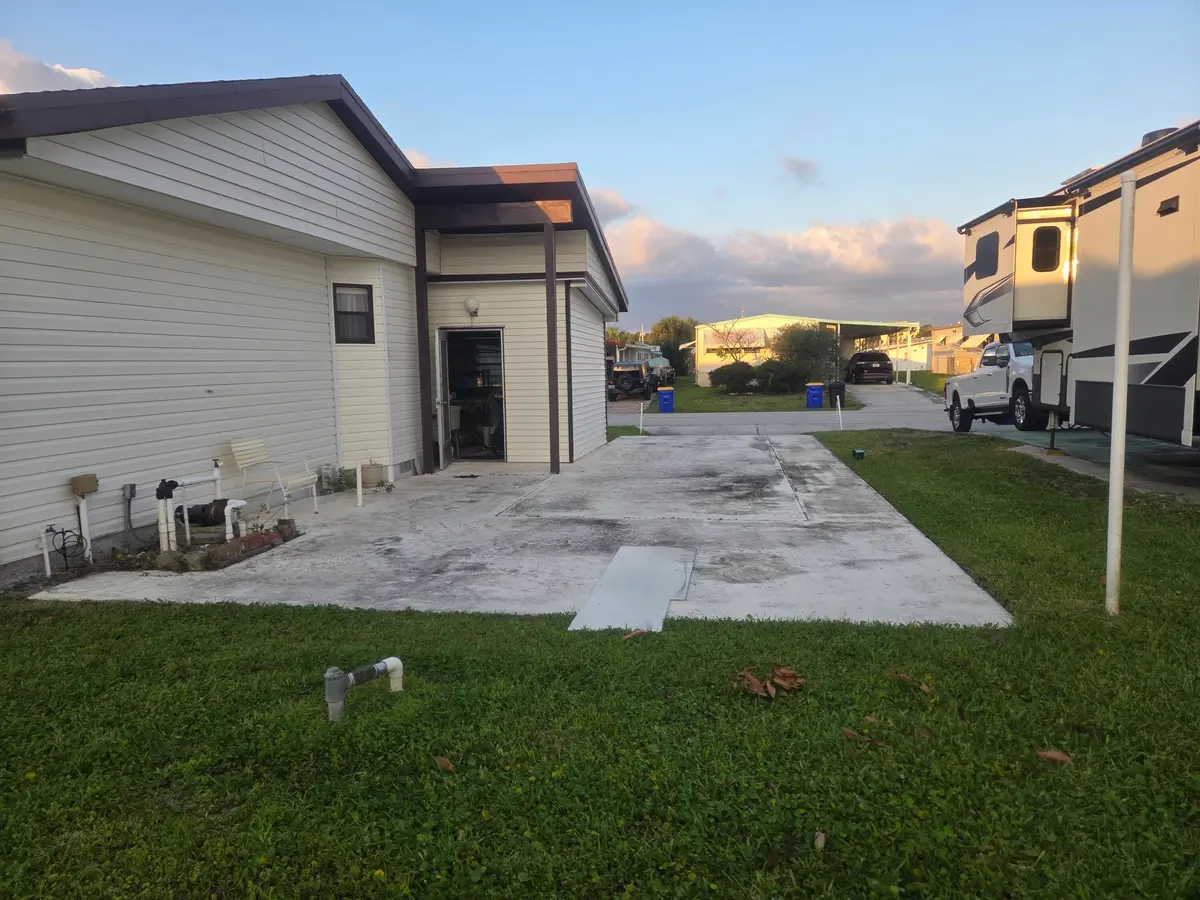 back with side driveway 2 at 7107 SE Seahawk Street, Hobe Sound