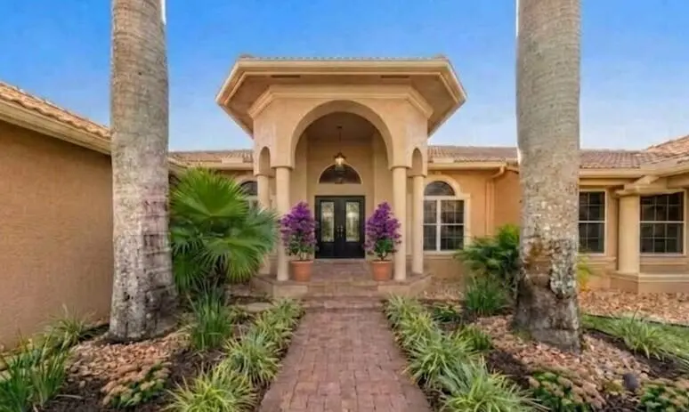 front updated with bougainvillea at 14390 Wellington Trace, Wellington