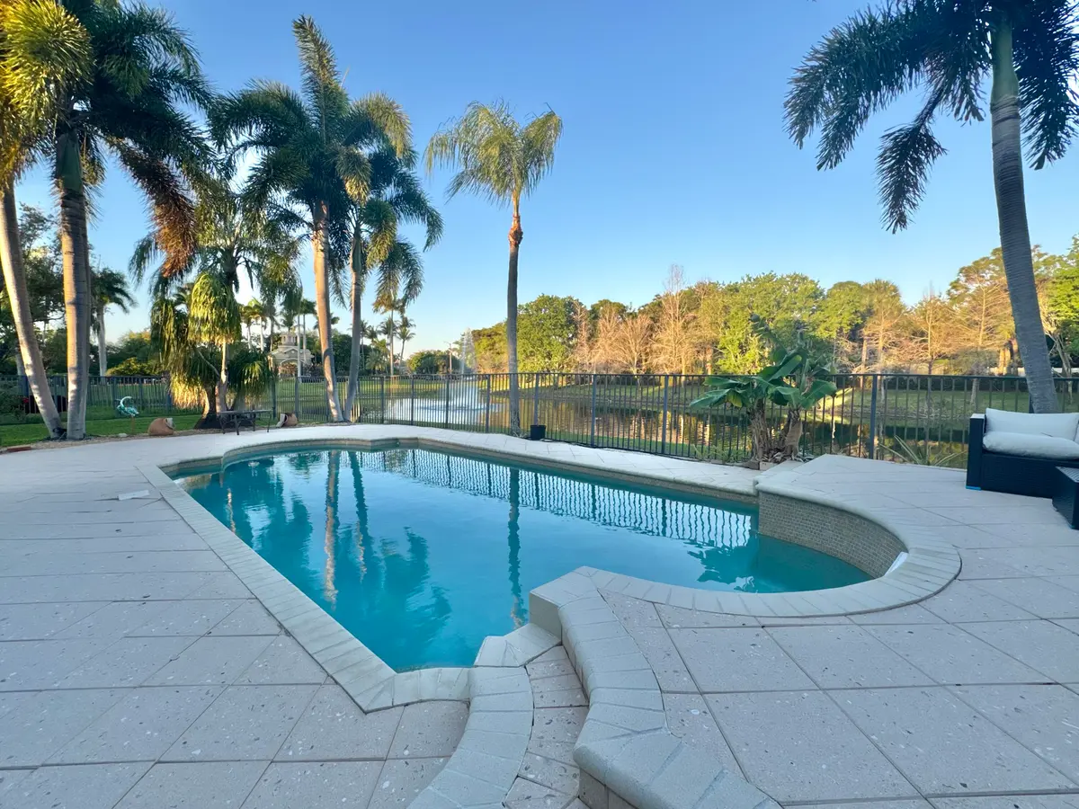 Pool Overlooking Peaceful Lake at 5330 Grand Banks Boulevard, Greenacres