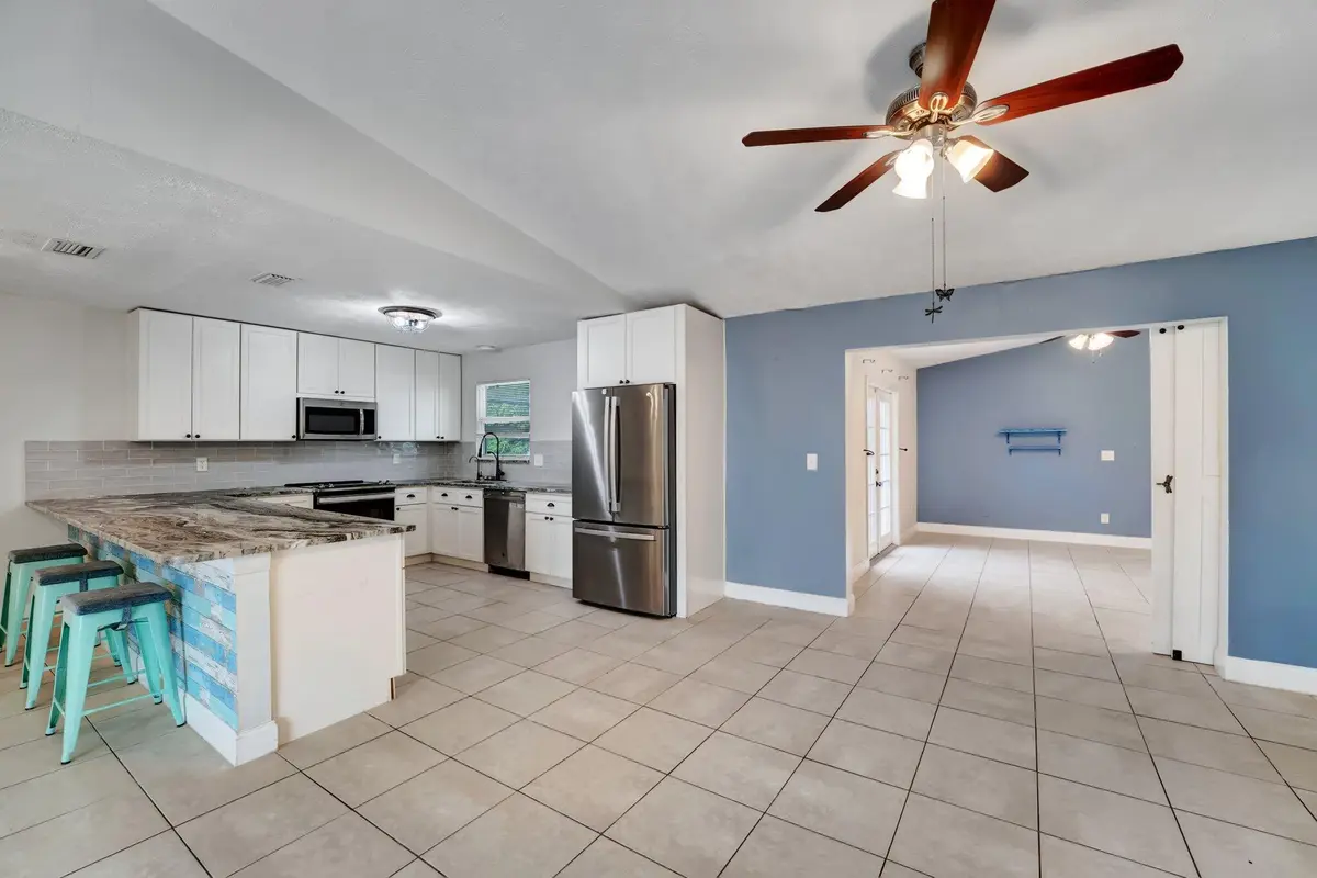 Kitchen with pool view. at 1918 SE Cheltenham Street, Port St. Lucie
