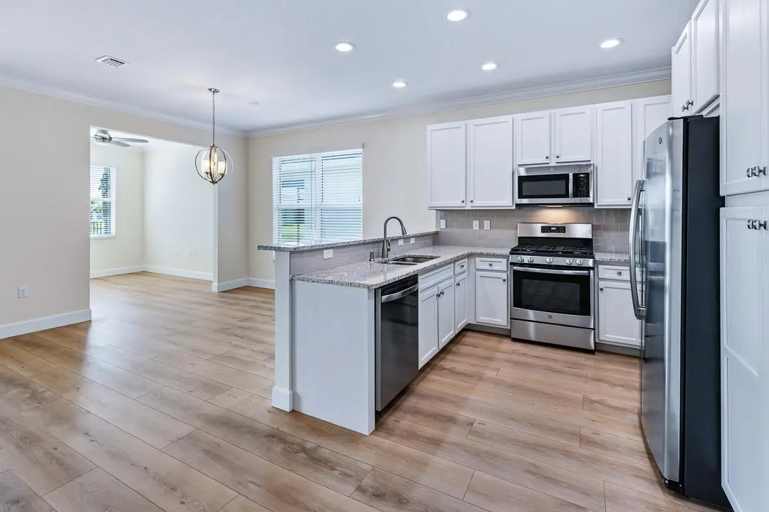 Kitchen opens to great room at 12186 SW Jasper Lake Way, Port St. Lucie