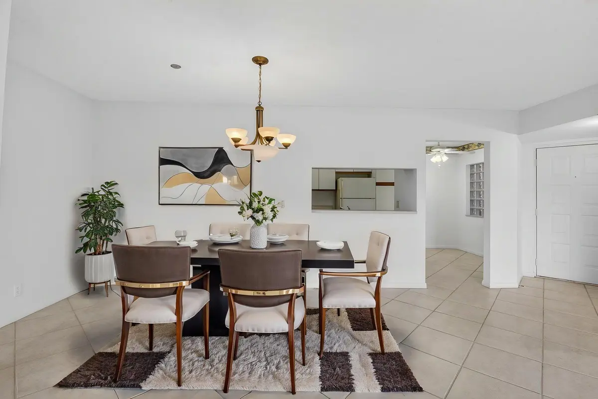 Virtually Staged Formal Dining Area at 5415 Verona Drive F, Boynton Beach