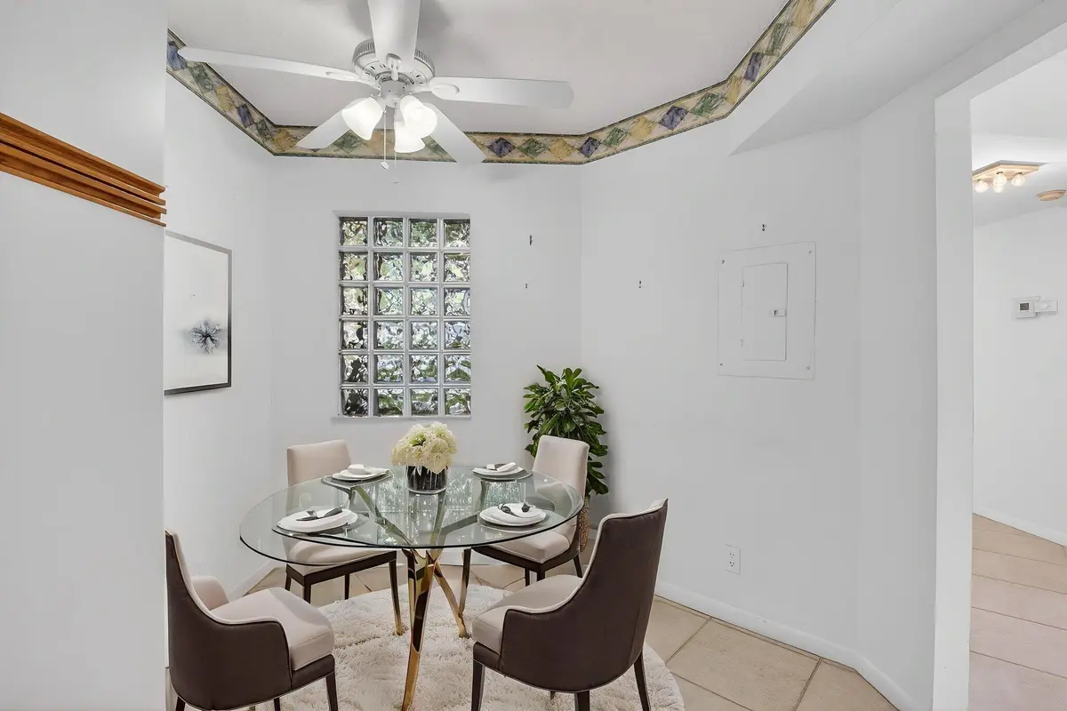 Virtually Staged Kitchen Breakfast Area at 5415 Verona Drive F, Boynton Beach
