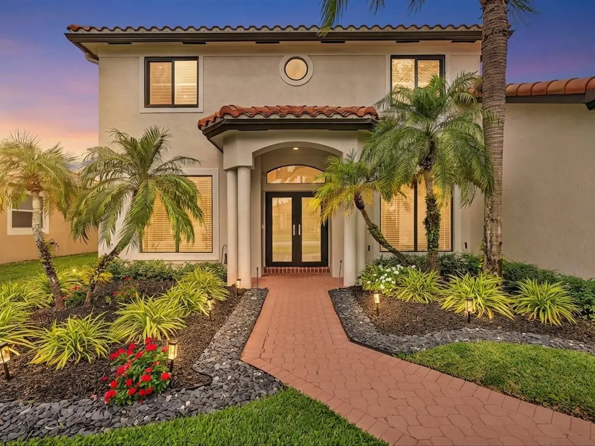 Front Exterior Twilight at 21831 Palm Grass Drive, Boca Raton