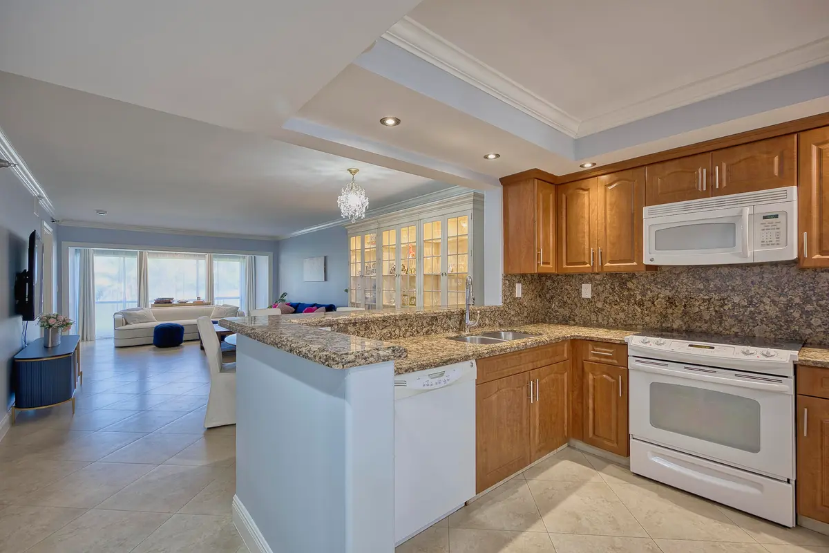 Kitchen Open to Living/Dining at 380 NW 67th Street Apt 101, Boca Raton
