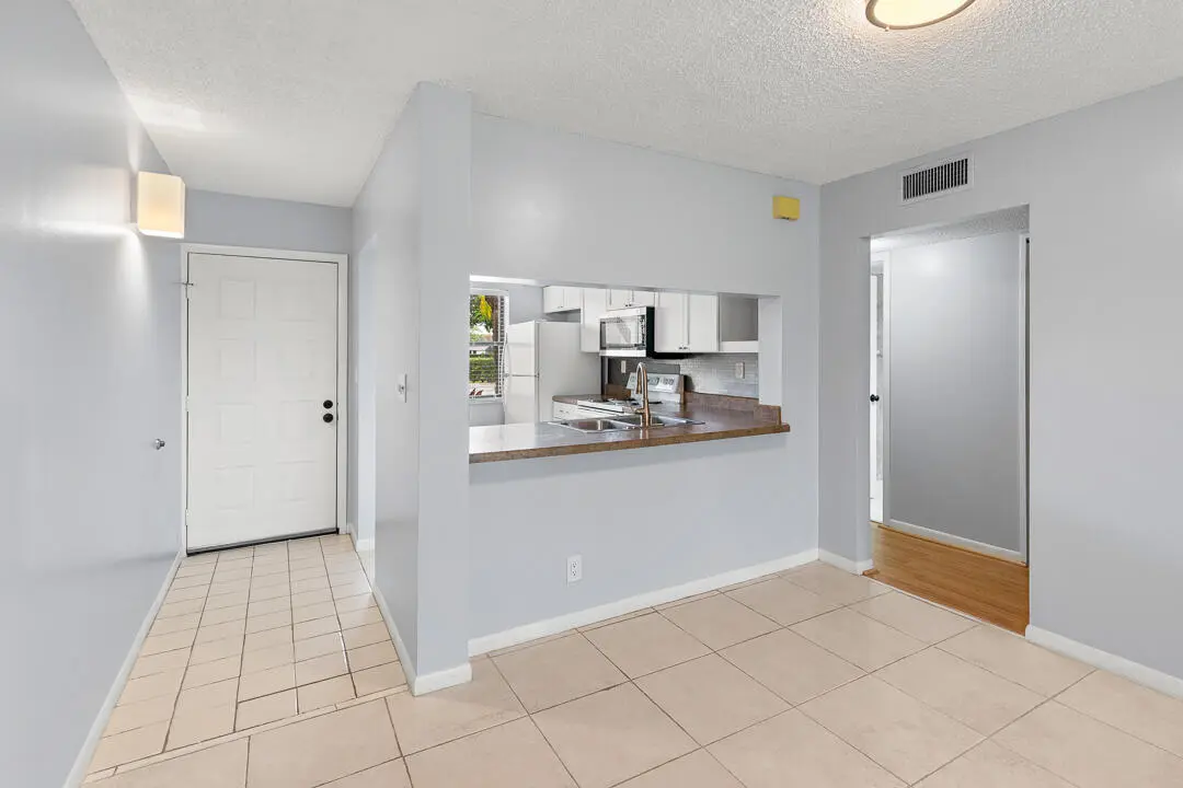 Foyer/Kitchen/Dining at 12962 Briarlake Drive 103, Palm Beach Gardens