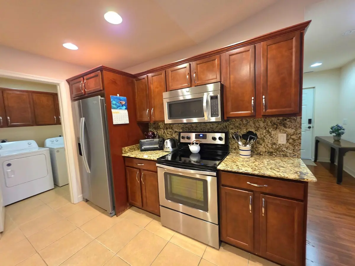 Shows Laundry Rm next to Kitchen at 17 San Felipe, Fort Pierce