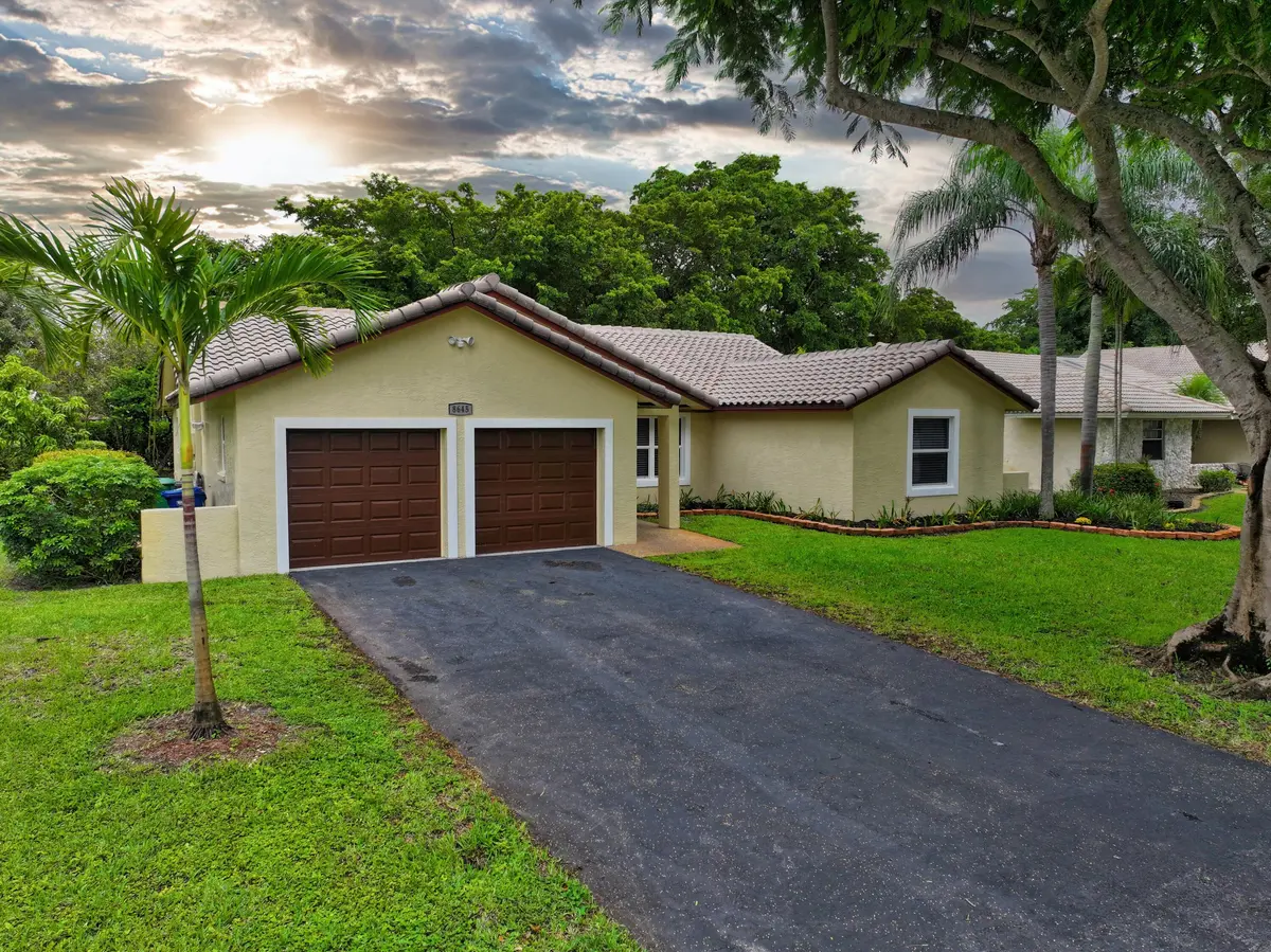 Front with Sky at 8645 NW 47th Drive, Coral Springs
