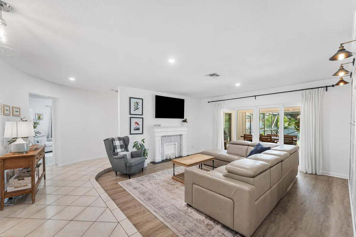 Living Room w/ Tiled Feux Fireplace at 17680 Pine Needle Terrace, Boca Raton