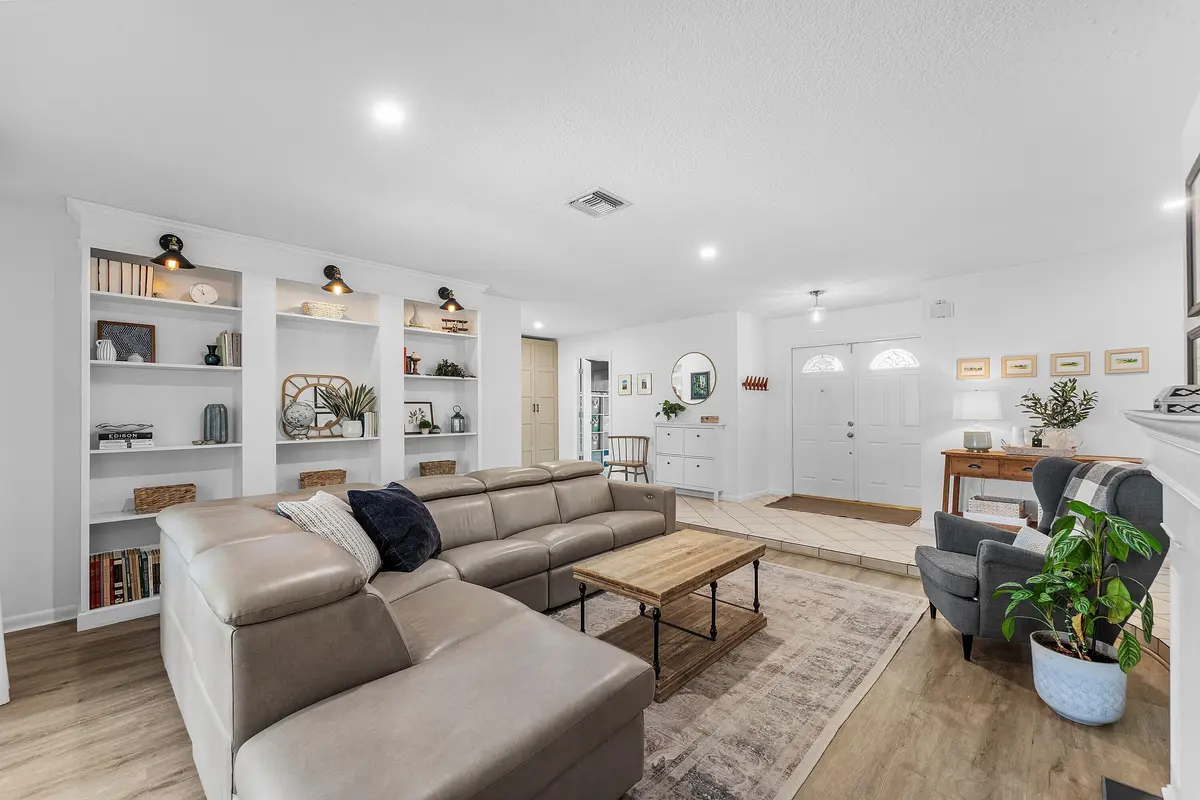 Living Room w/ Built-in Lighted Bookcase at 17680 Pine Needle Terrace, Boca Raton