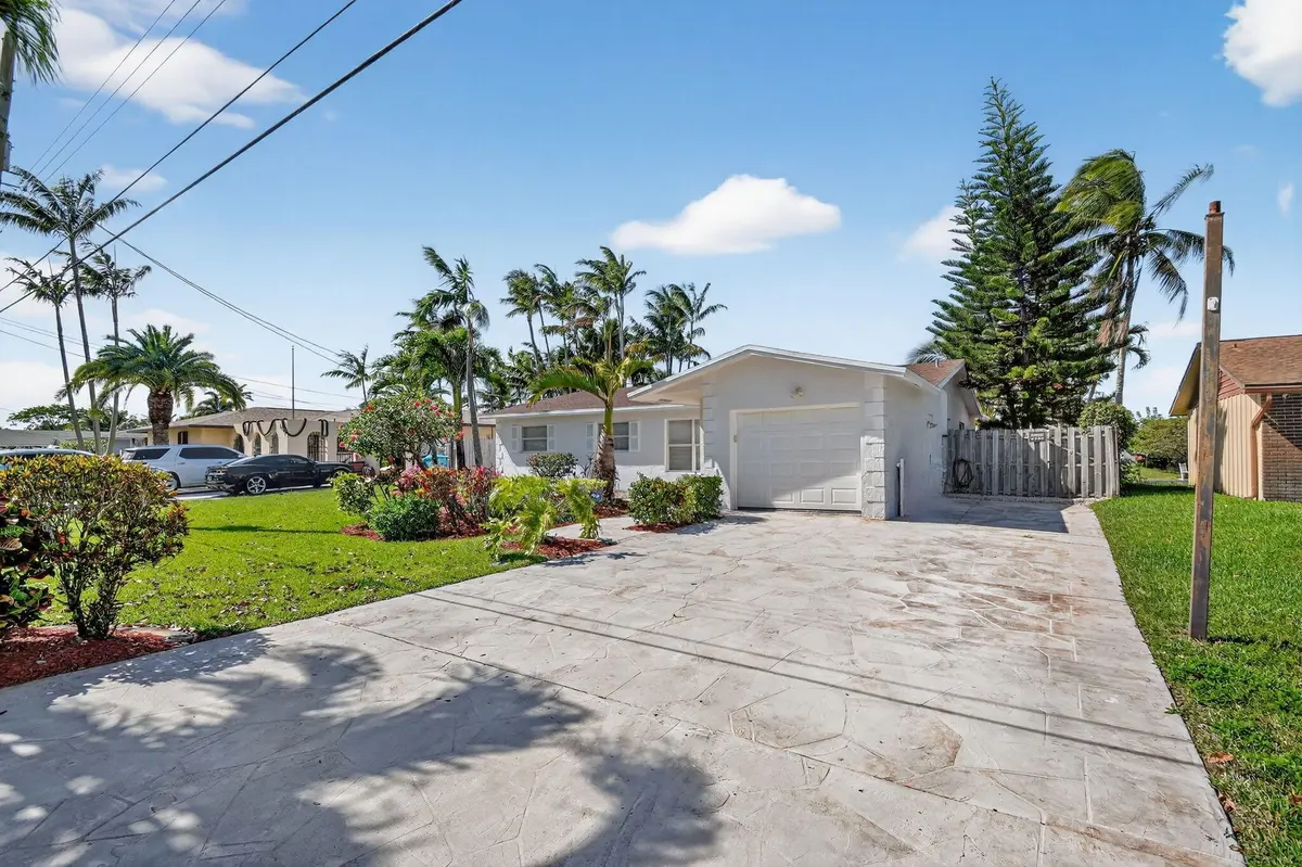 Front Exterior and Driveway at 1037 SW 27th Avenue, Boynton Beach