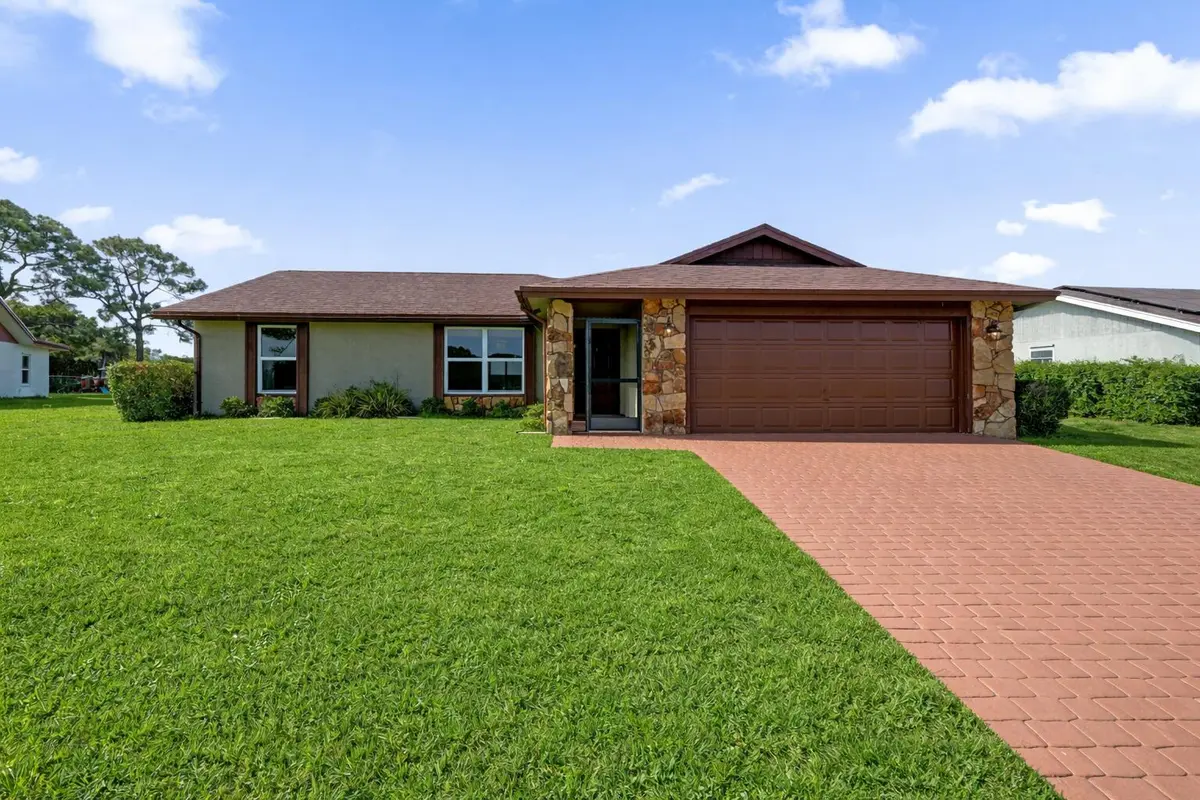 Charming suburban home with lush lawn at 140 Miramar Avenue, Royal Palm Beach