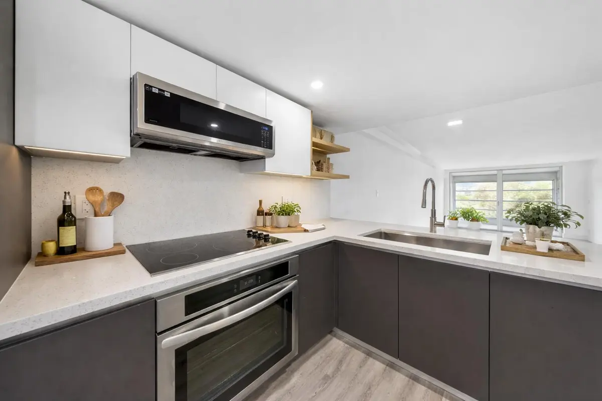 Modern U-shaped kitchen design at 3151 S Palm Aire Drive 407, Pompano Beach