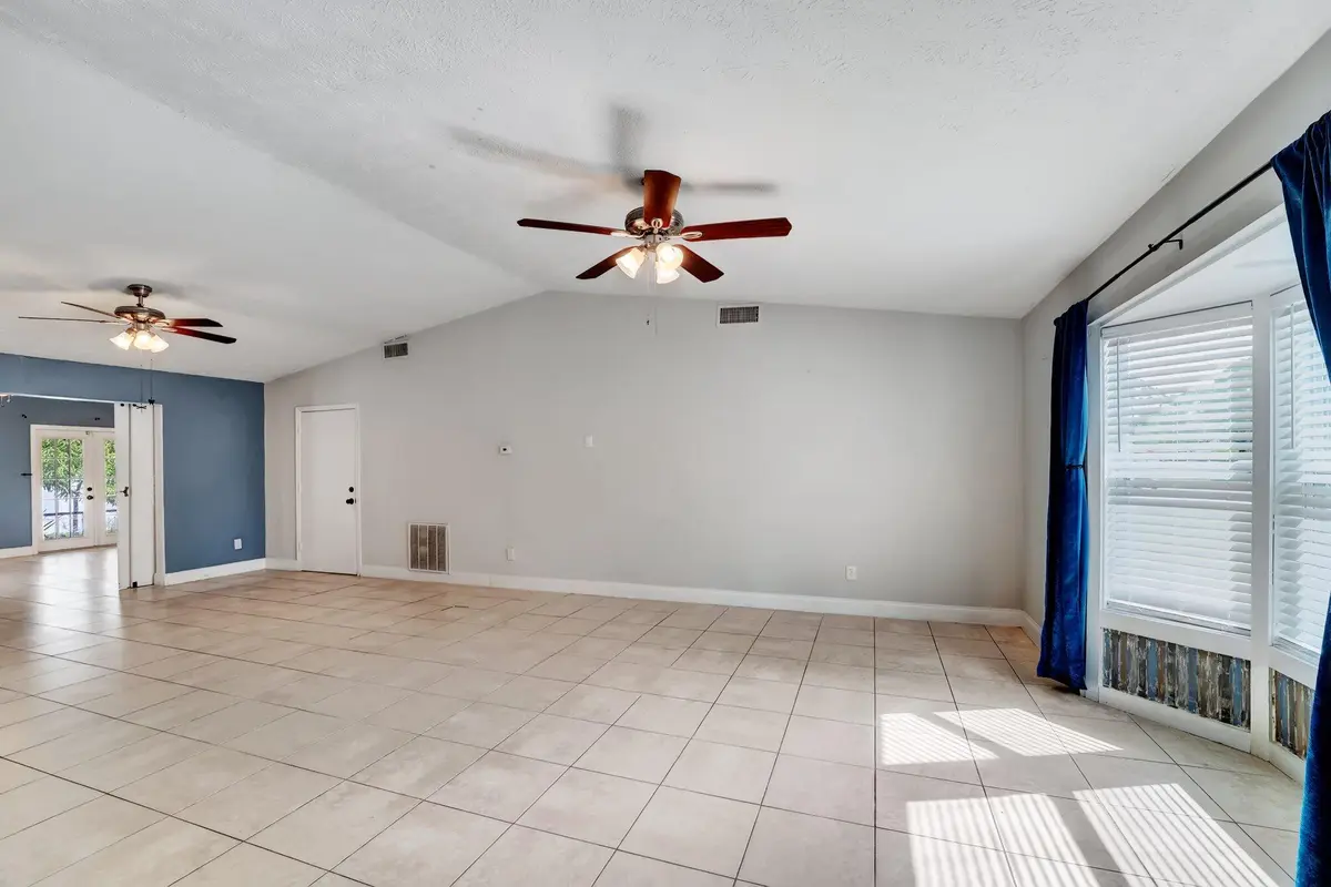 Entry room with bay window at 1918 SE Cheltenham Street, Port St. Lucie