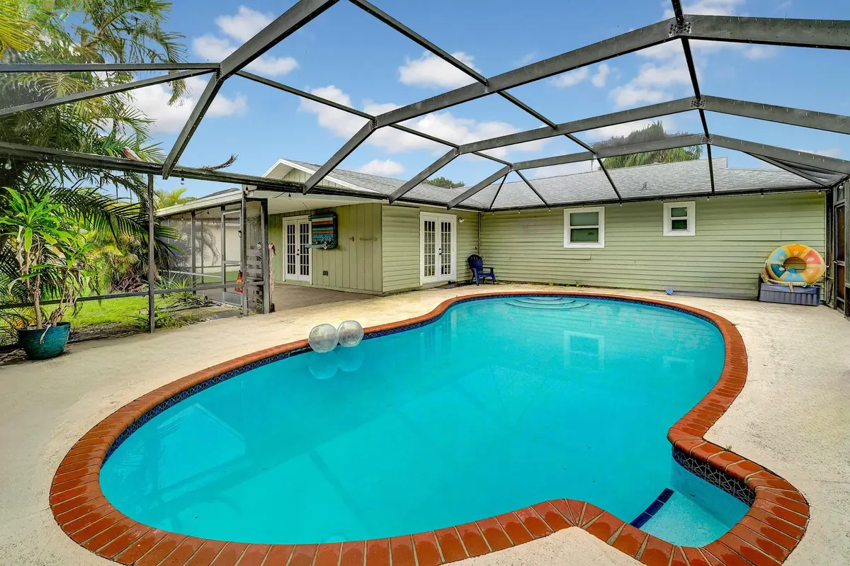 Screened in pool with new pump. at 1918 SE Cheltenham Street, Port St. Lucie
