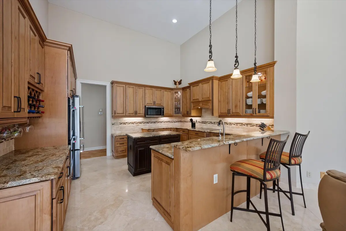 Kitchen with center island at 1776 Breakers West Boulevard, West Palm Beach