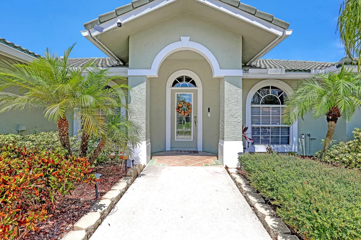 Covered entry at 133 Black Olive Crescent, Royal Palm Beach