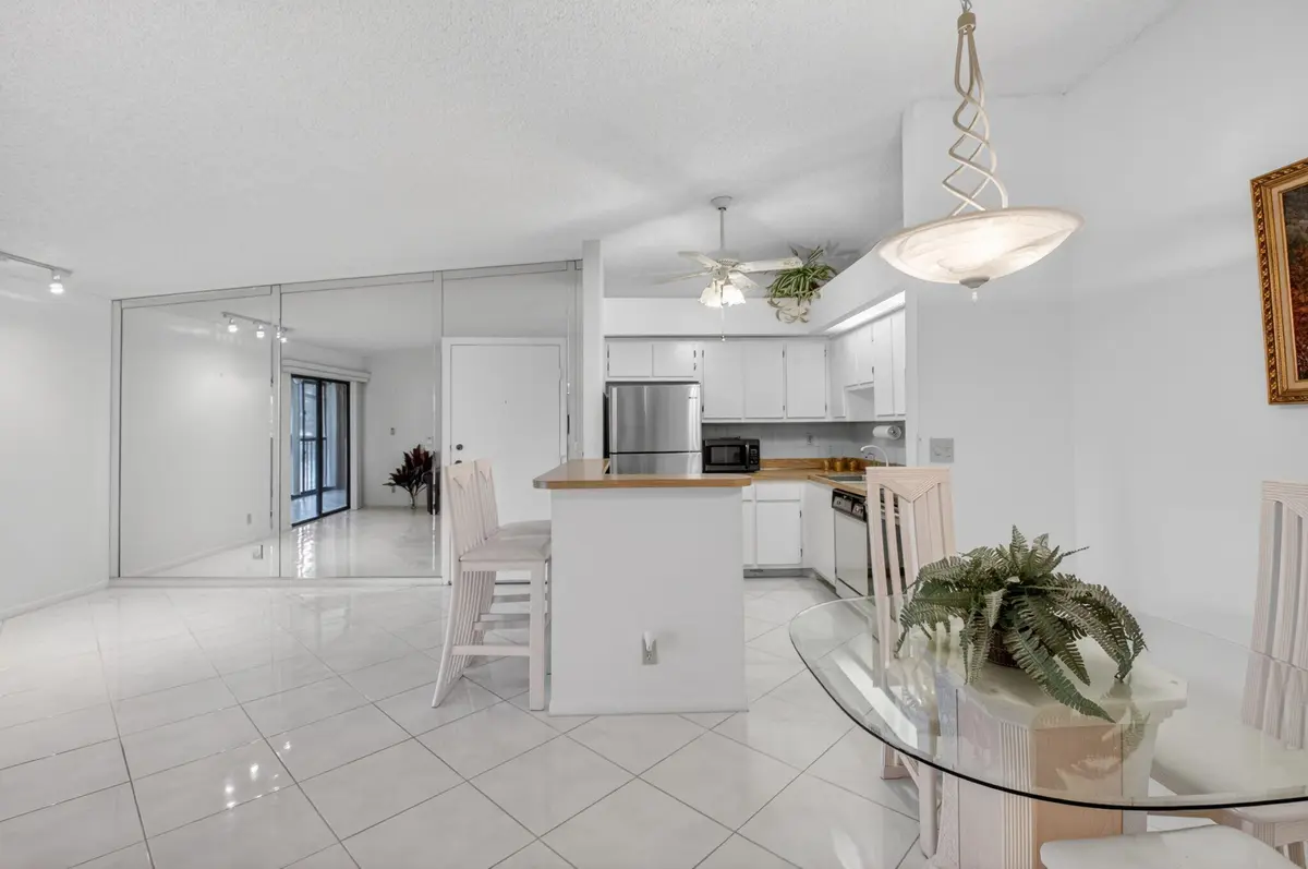 Living area & kitchen at 15496 Lakes Of Delray Boulevard 206, Delray Beach