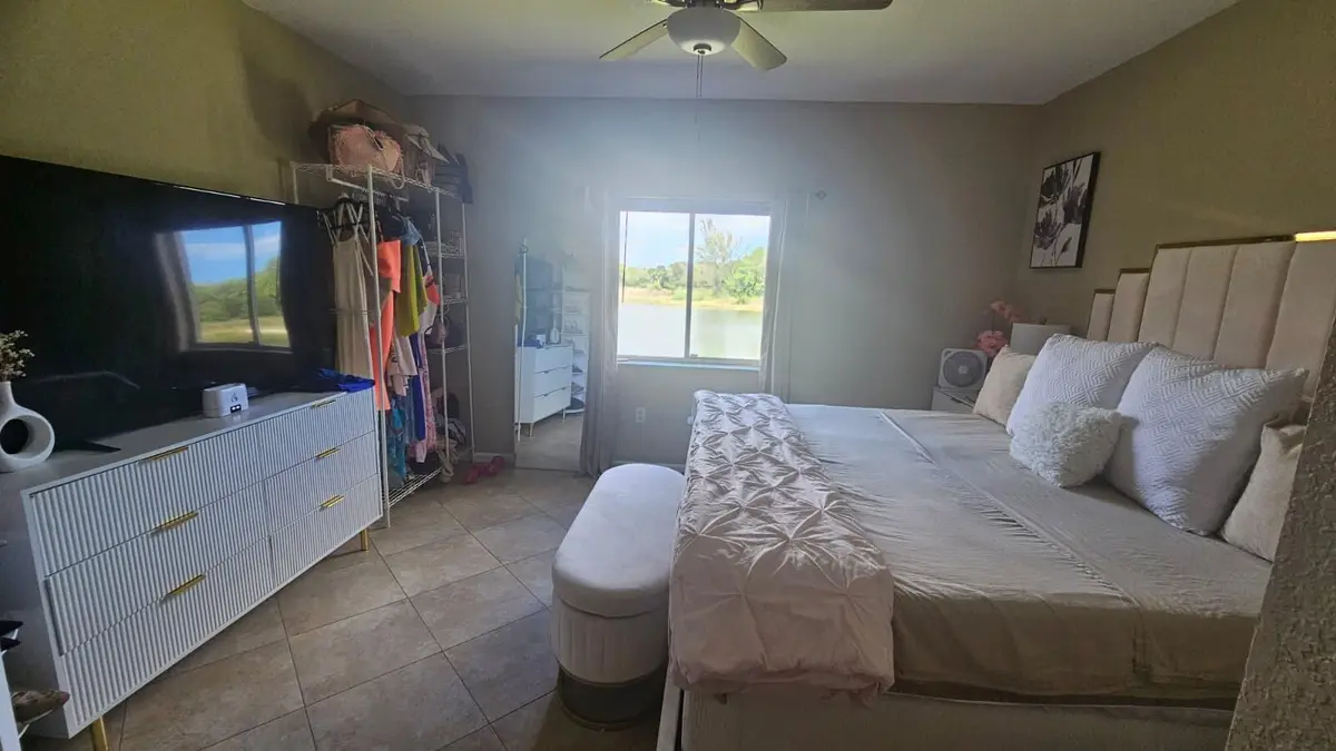 1145 master bedroom 1 at 1145 Golden Lakes Boulevard 725, West Palm Beach