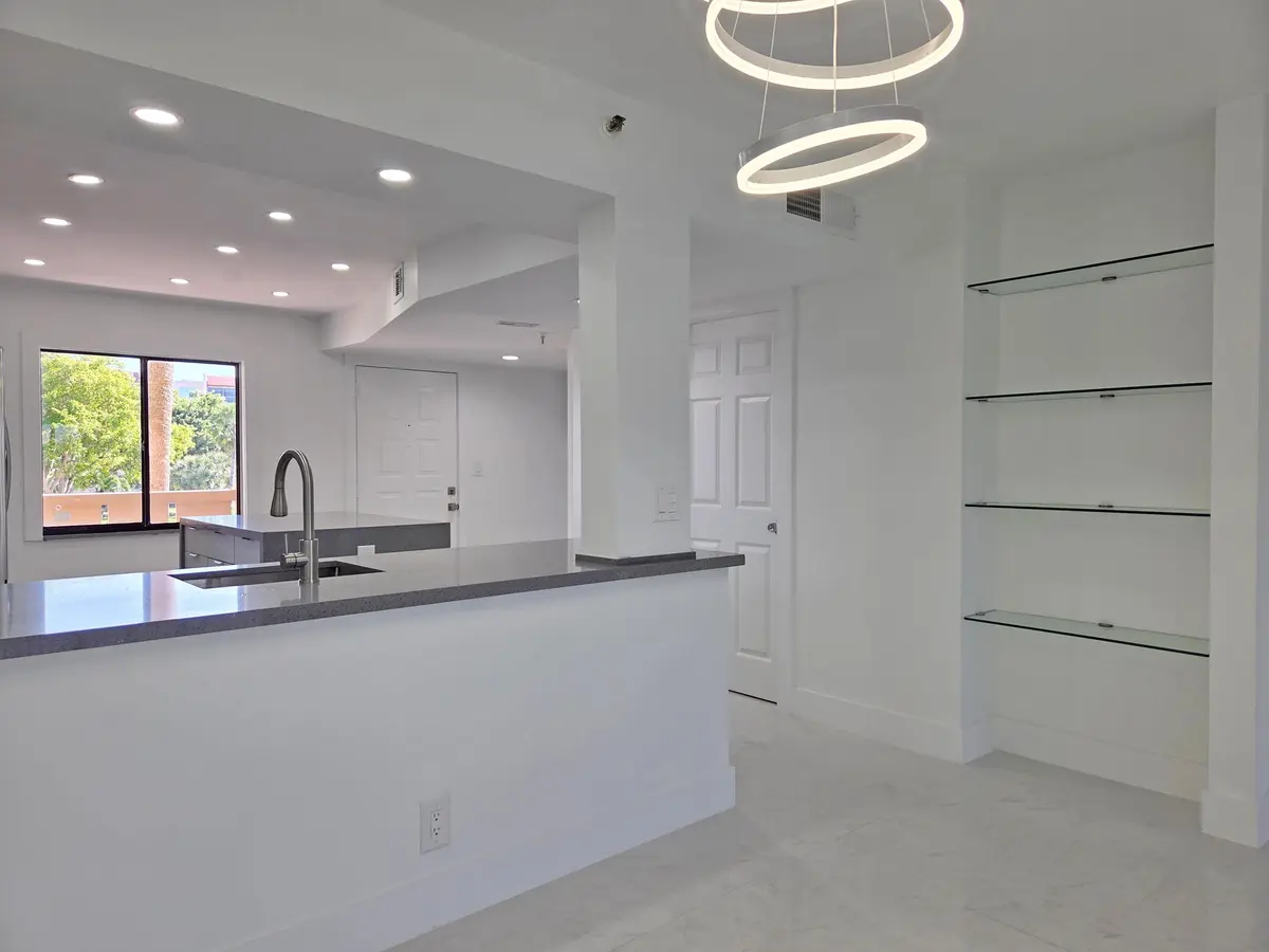 Entry Way and Floating Glass Shelves at 14460 Strathmore Lane 307, Delray Beach